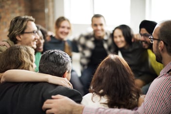 Group of people forming a circle during workshop