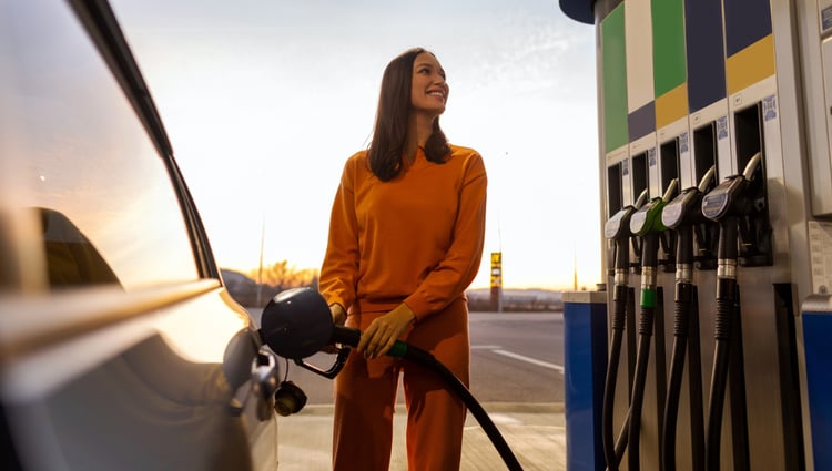 woman filling car at petrol bowser