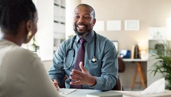 Male doctor consulting a patient