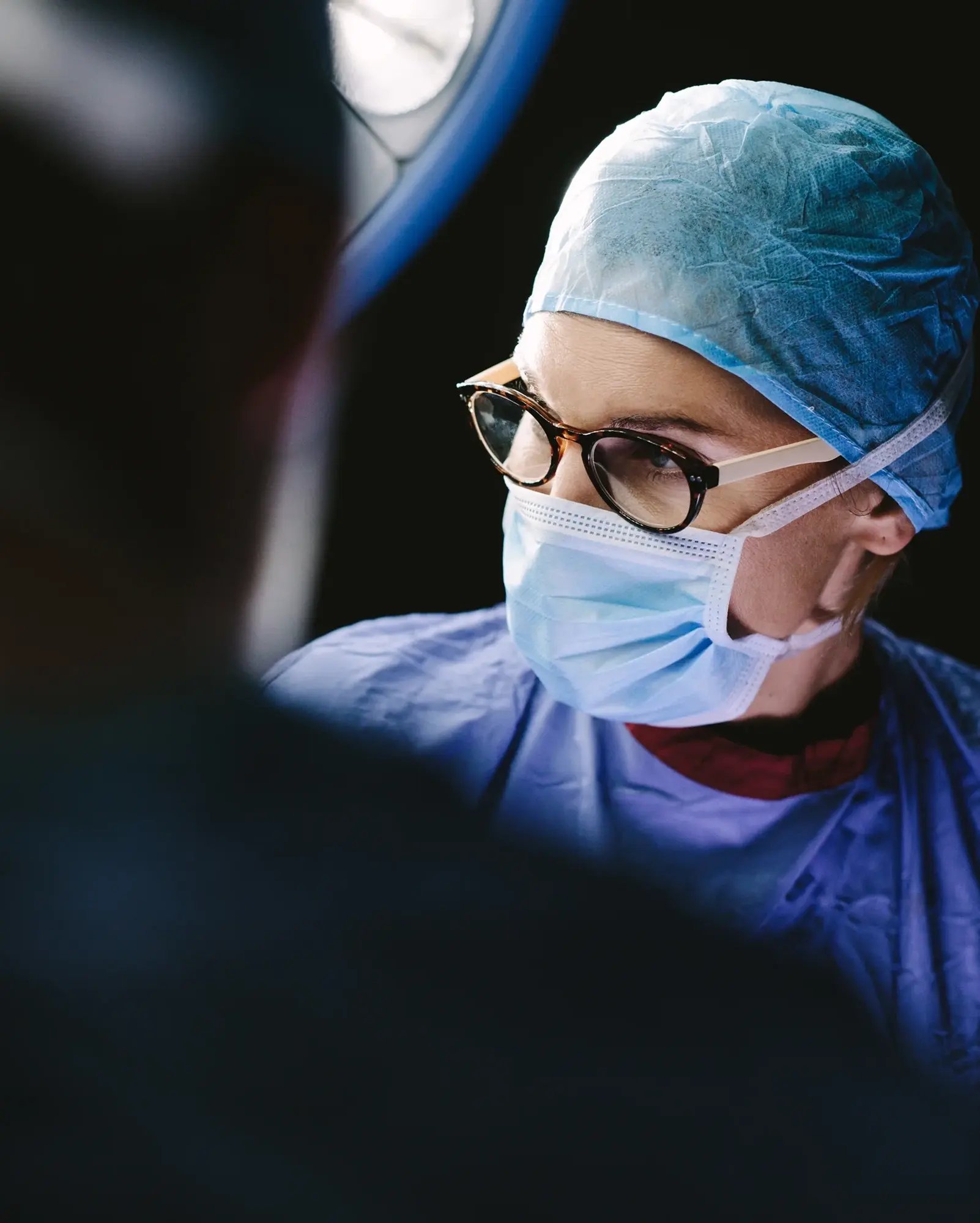 doctor-smiling-in-hospital-reception 1