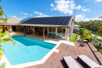 House with solar panels and a pool