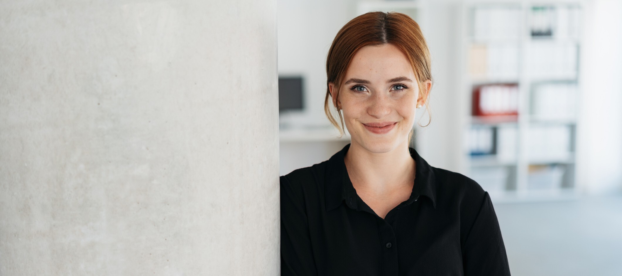 woman with red hair smiling